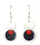 Silver oval w/black & red circles